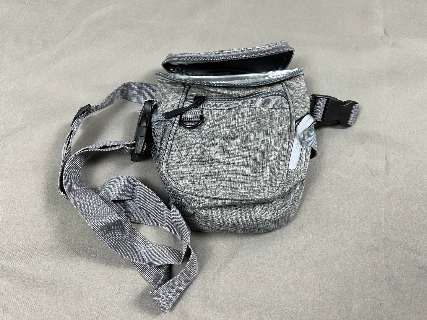 Dog walking bag with treat pouch and storage for training gear