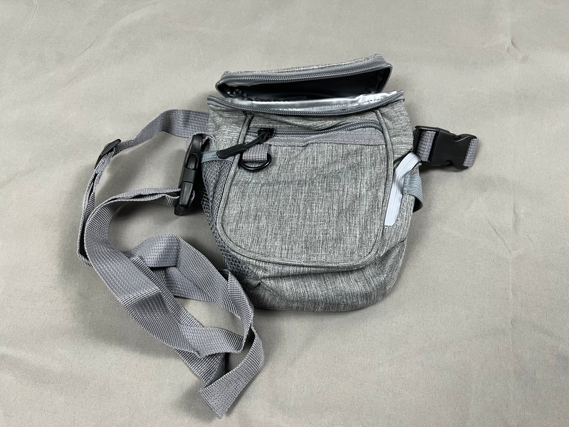 Dog walking bag with treat pouch and storage for training gear